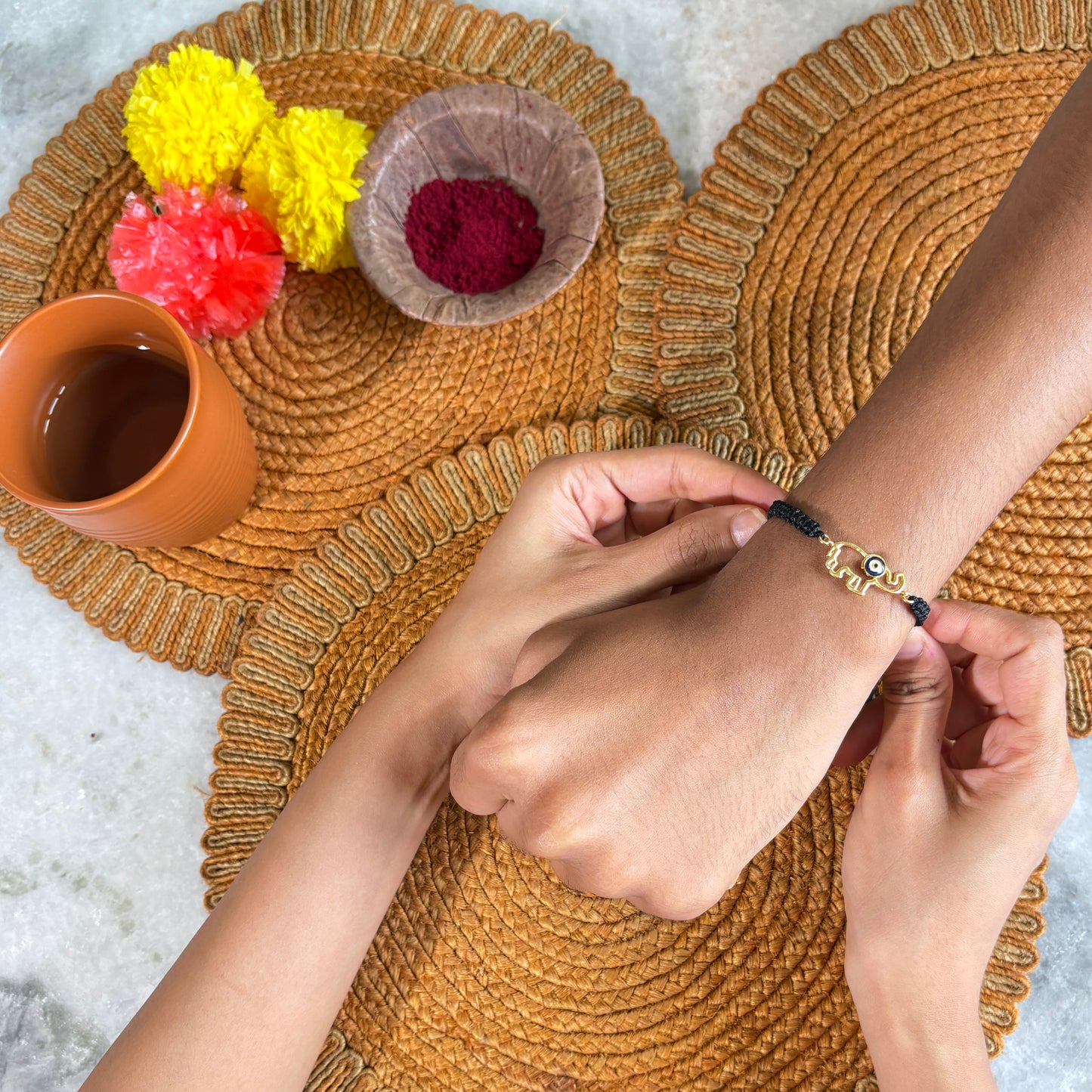 Baahu - Evil Eye & Ganesha Gold Rakhi